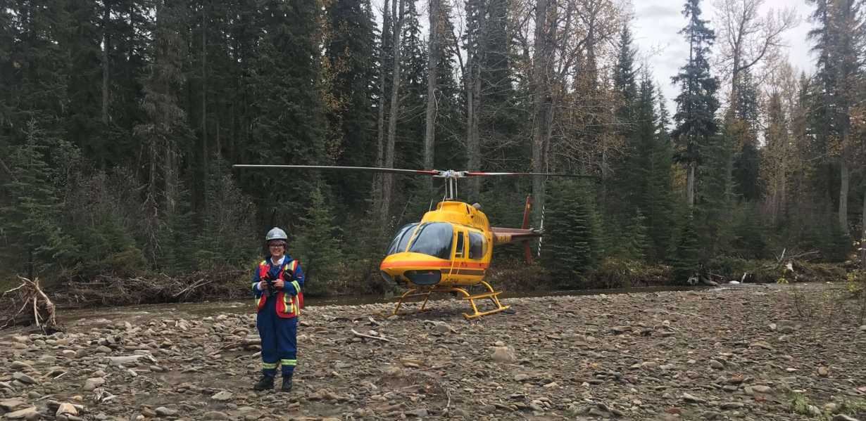 a person standing in front of a helicopter