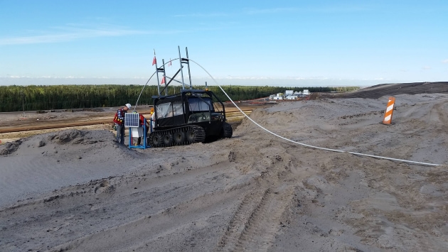 a vehicle in a dirt area